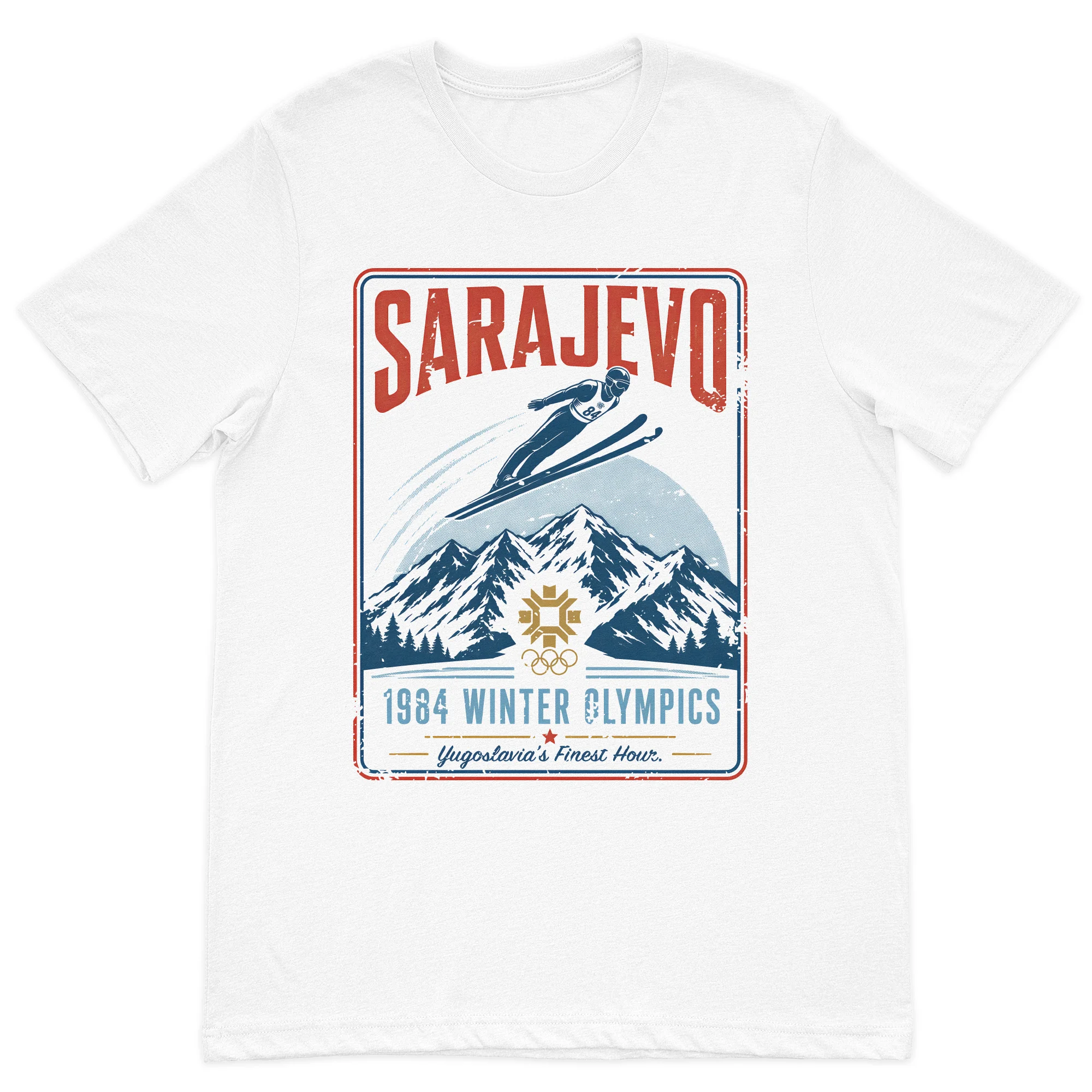 Vintage Sarajevo 1984 winter sports inspired graphic t-shirt featuring mountain scenery and a retro travel poster design on a premium white cotton t-shirt.