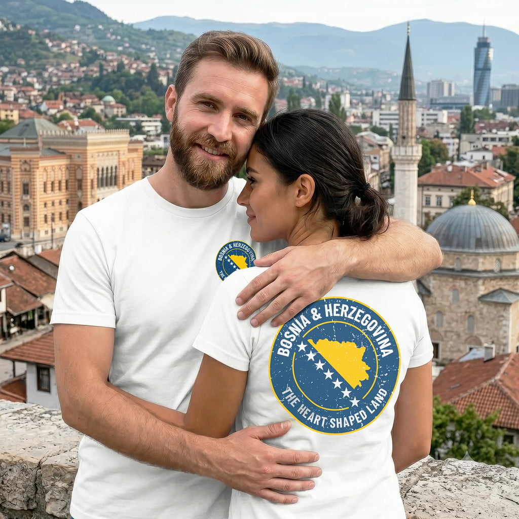 Two people wearing white t-shirts with a Bosnia and Herzegovina logo against a cityscape background.
