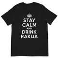 Stay Calm and Drink Rakija funny Balkan graphic t-shirt featuring bold white typography on a premium black cotton t-shirt.