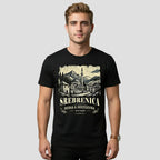 Man wearing a black Srebrenica t-shirt with a graphic design and text on a plain background