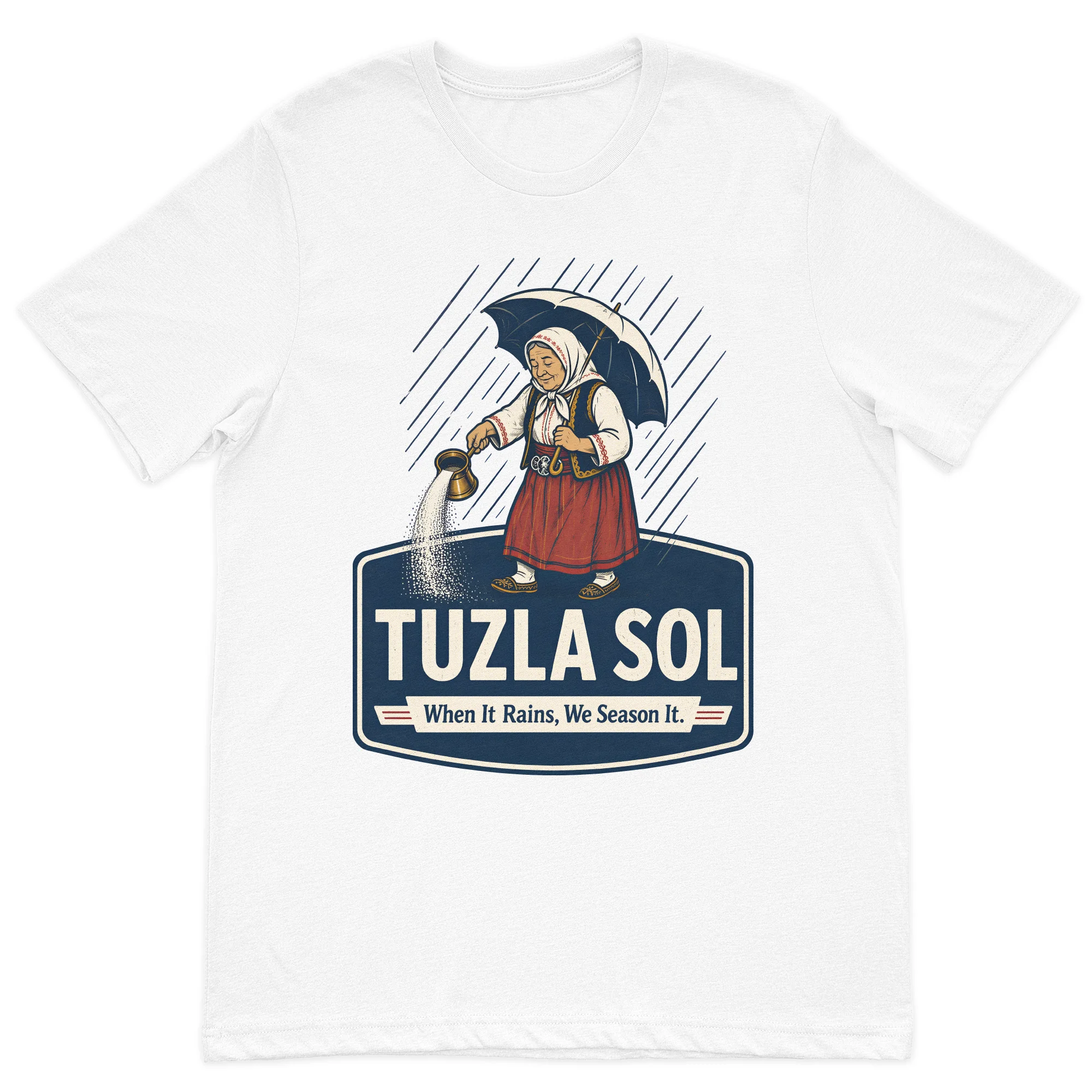 Tuzla Sol graphic t-shirt featuring a traditional Bosnian woman spreading salt in the rain with the slogan "When It Rains, We Season It" on a premium white cotton t-shirt.