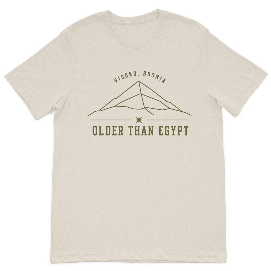 Visoko Bosnia "Older Than Egypt" minimalist graphic t-shirt featuring a line-art Bosnian Pyramid design on a premium cream cotton t-shirt.